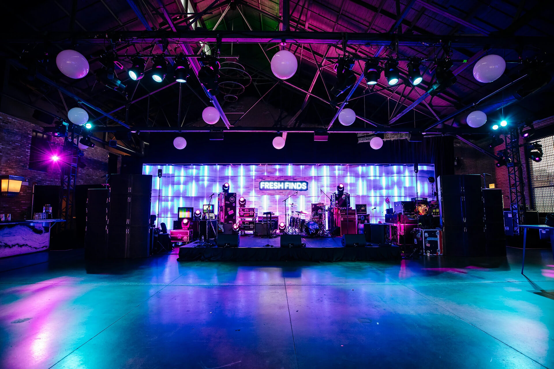 Dimly lit stage with colourful lighting at the Spotify Fresh Finds event
