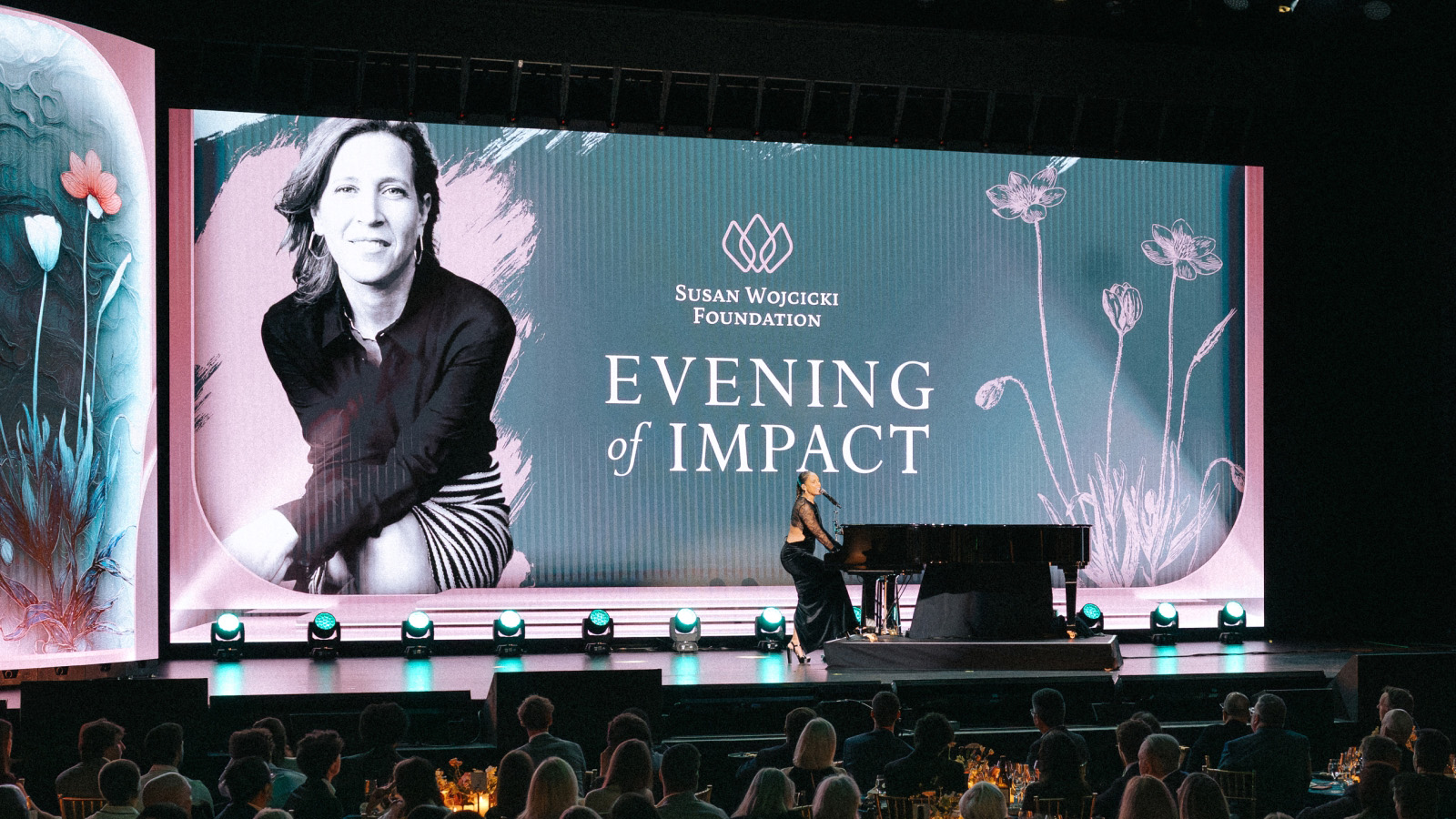 Pianist onstage beside the Evening of Impact screen at the Susan Wojcicki Foundation launch