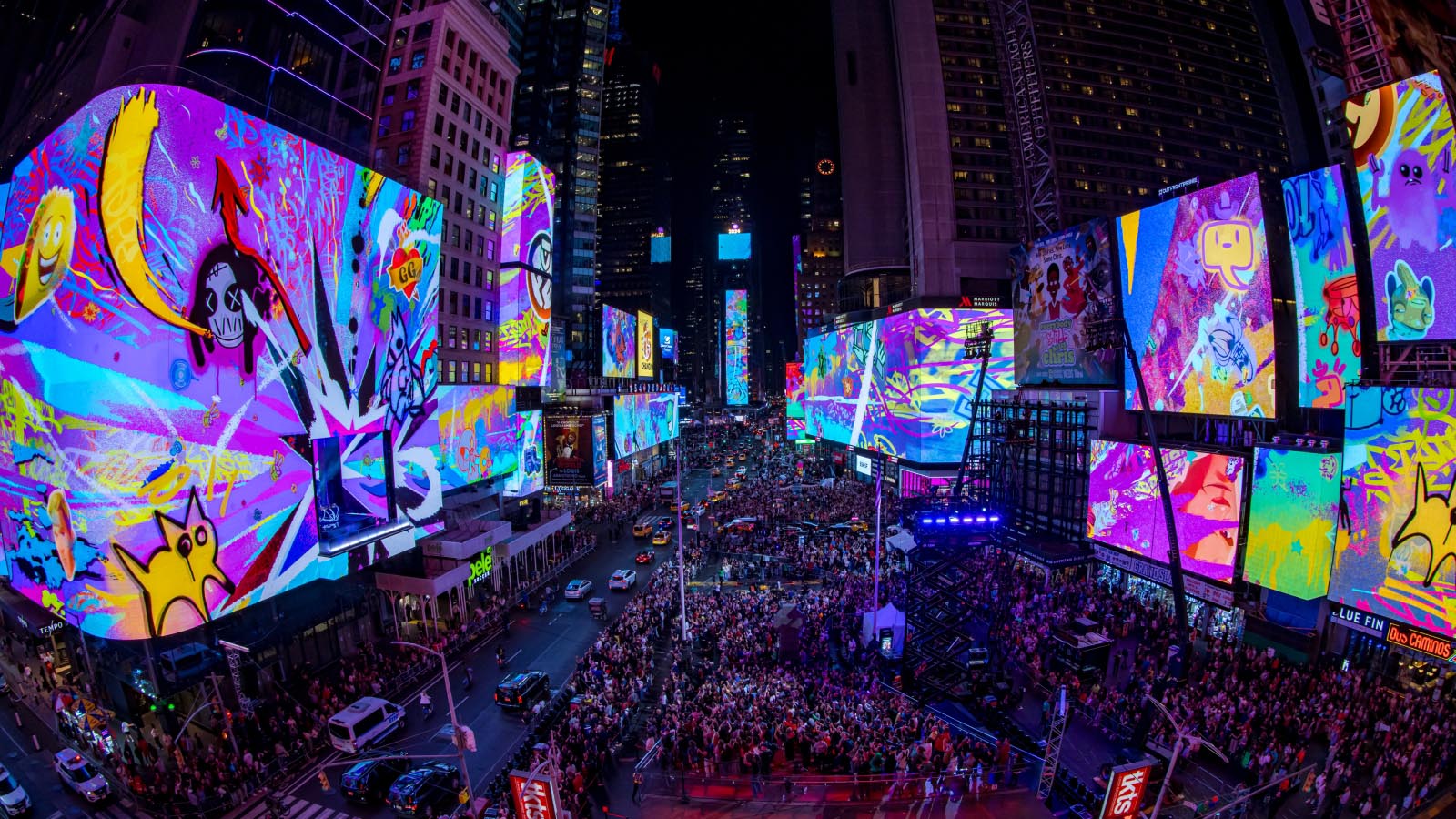 Times Square at night wrapped in vivid purple digital-art LED billboards above a crowd