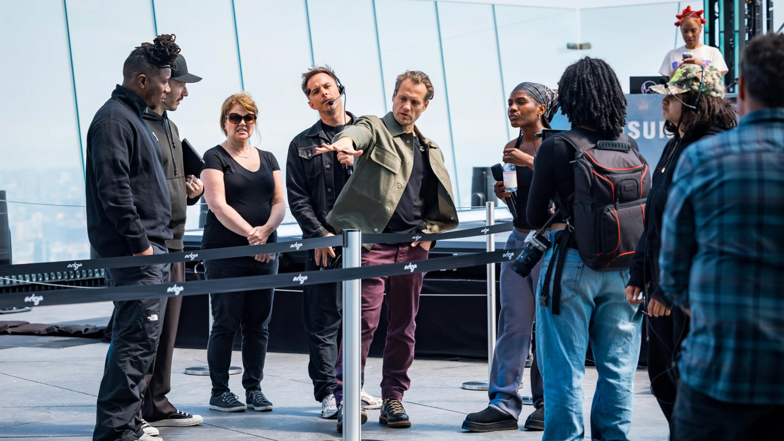 Crew and talent in a rooftop production briefing at a Samsung skyline event