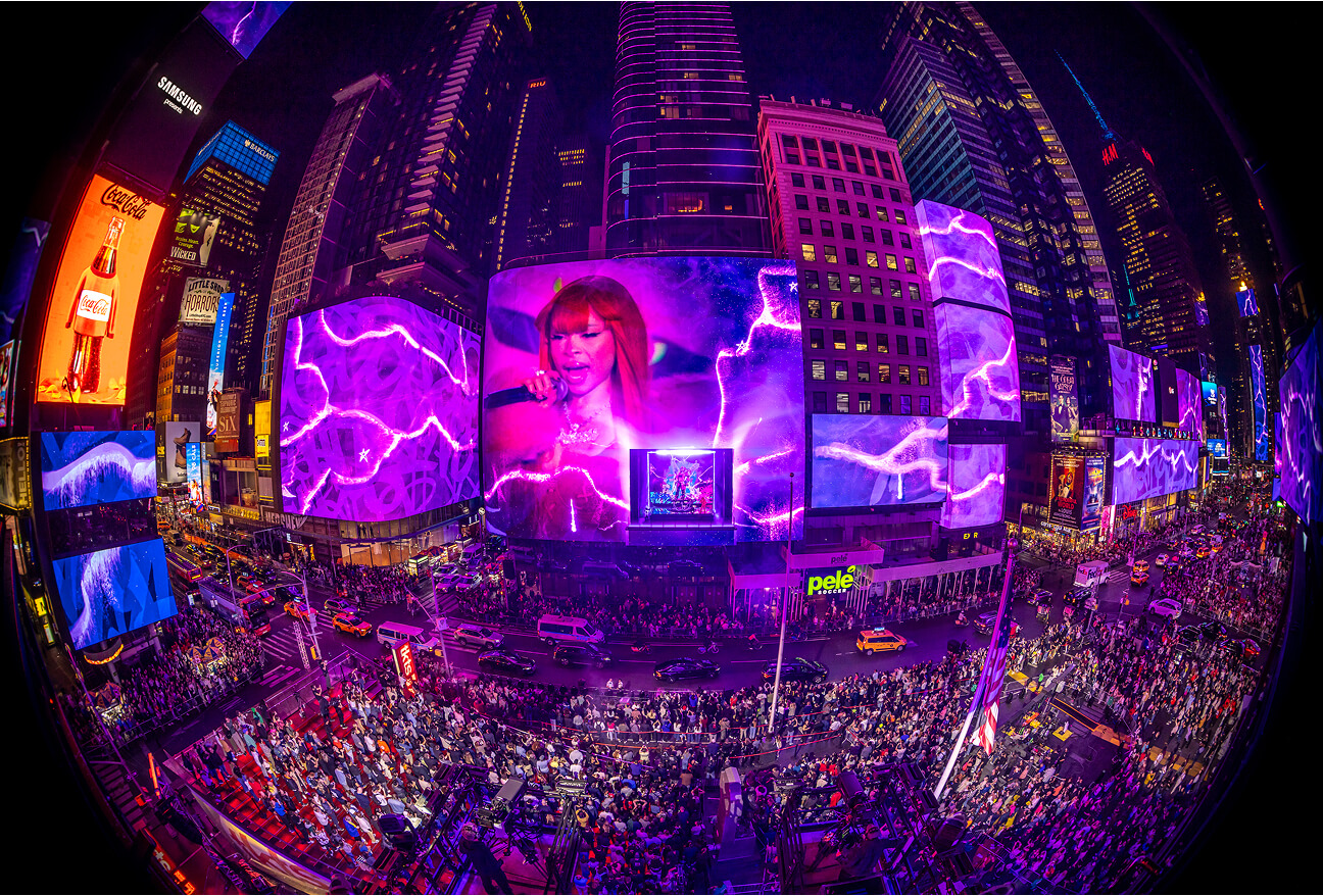 Fisheye view of Times Square screens and huge crowd during the Fortnite Chapter 2 Remix launch show