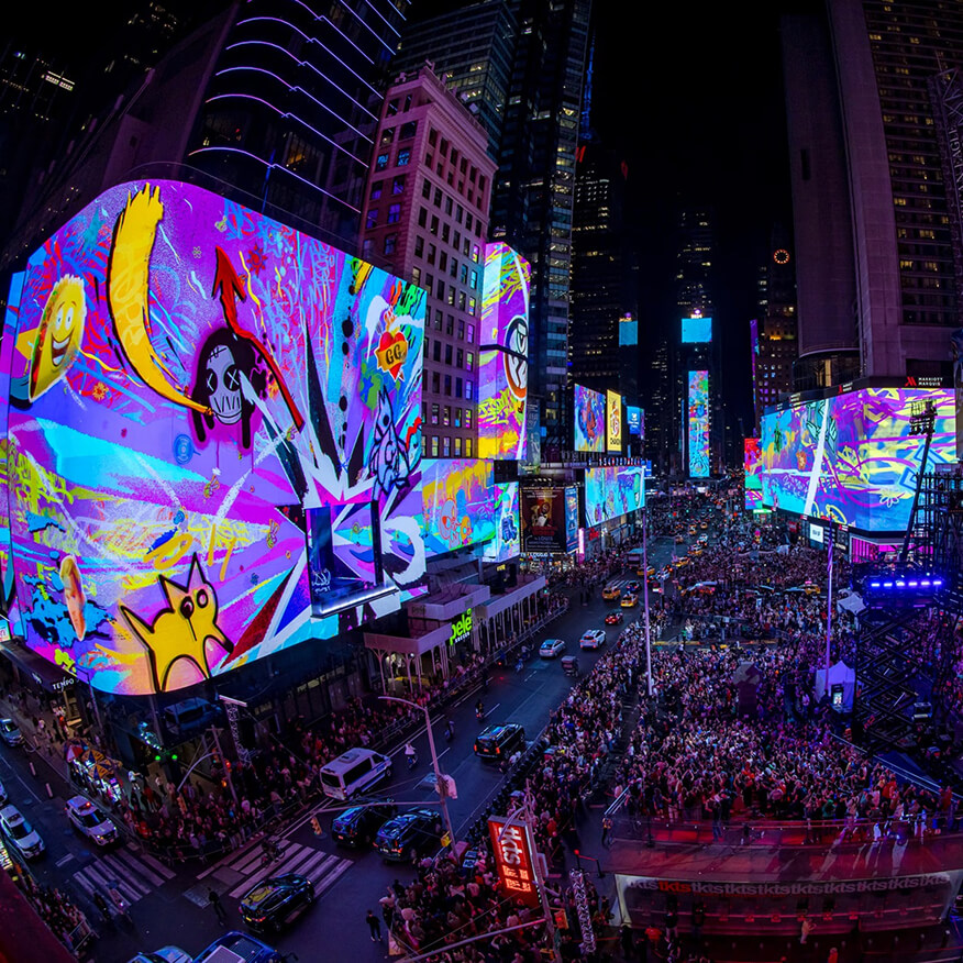 Giant animated cartoon artwork lights Times Square screens over crowds at the Fortnite Remix launch