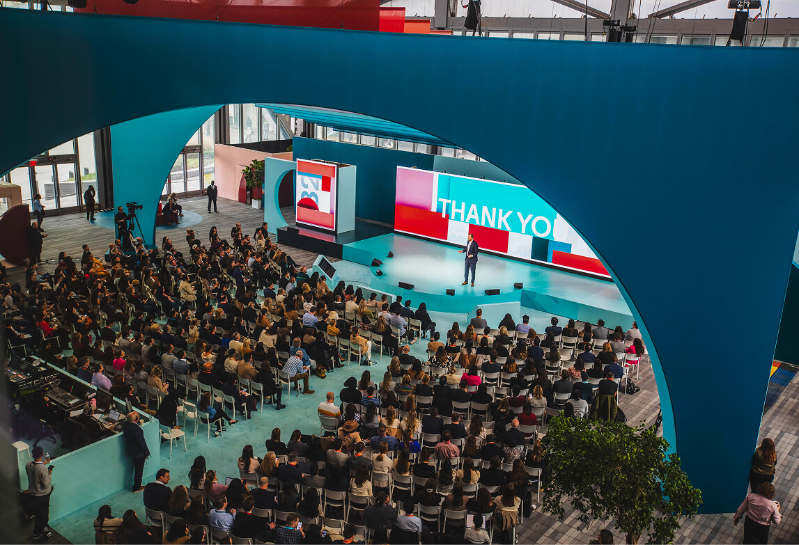 Overhead view of seated crowd and Thank You LED screen at LinkedIn B2Believe conference