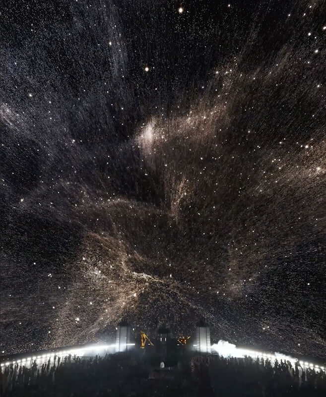 Starfield and cosmic dust projected across The Sphere dome over John Summit's stage