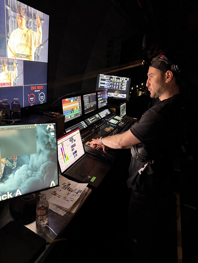 Video operator at the control desk monitoring show feeds backstage at John Summit's Sphere production